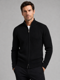 Front view of a man wearing a black ribbed knit cardigan sweater with a full zip front, stand collar, slim fit, and long sleeves