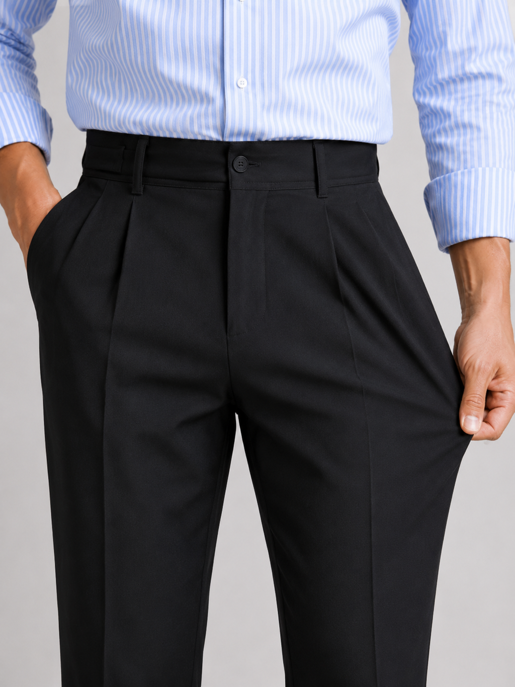Close up of black summer trousers showing lightweight stretch fabric and tailored straight leg detail