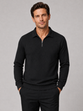 Front view of a man wearing a black lightweight knit quarter zip polo sweater with long sleeves