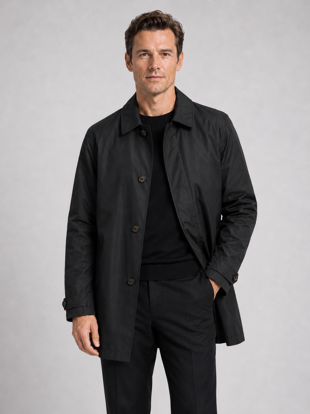 Men wearing black medium length trench coat lapel button up warm fall winter business casual style