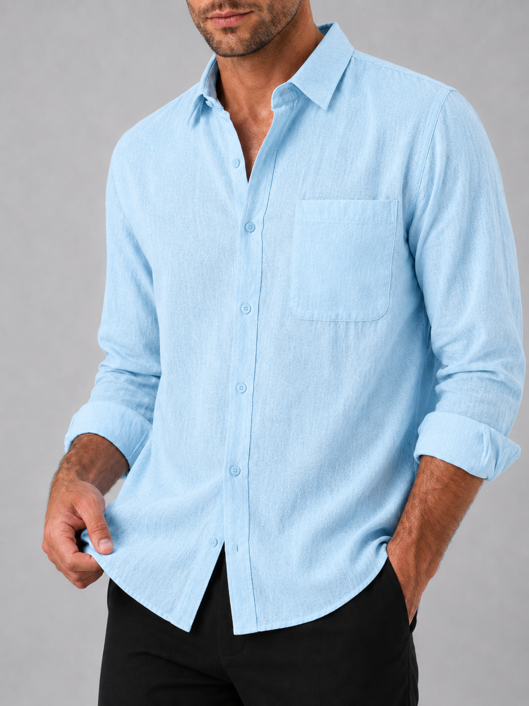 Close up of light blue button down shirt showing lightweight breathable fabric and classic collar detail