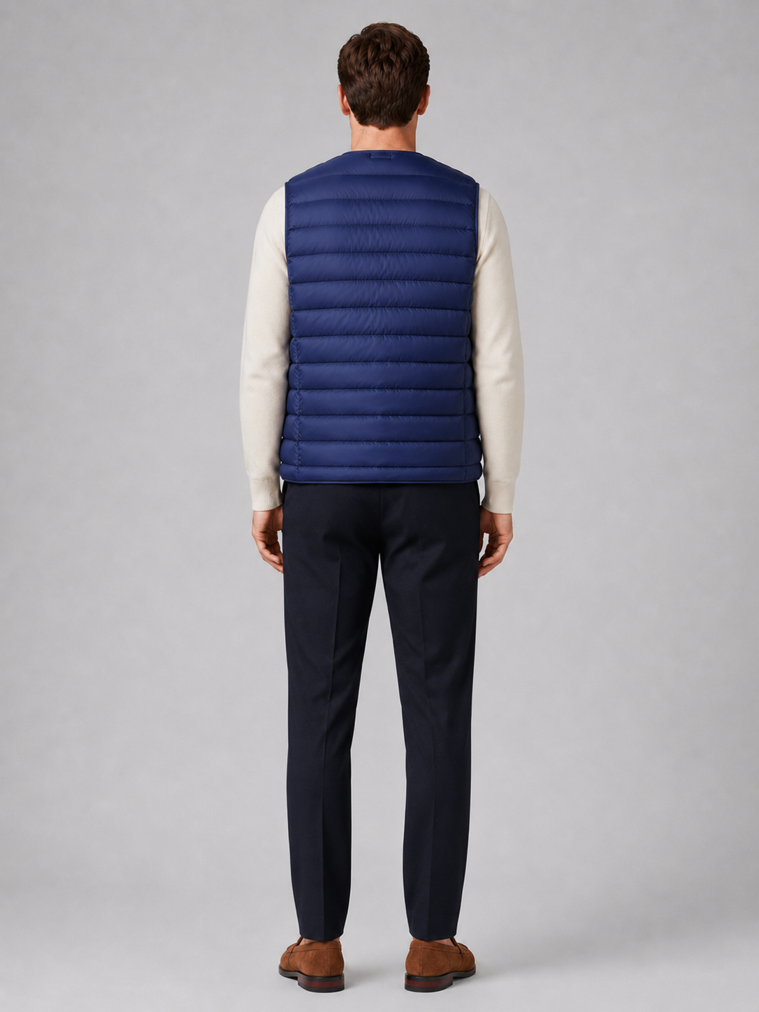Men’s blue insulated puffer vest comfortable sleeveless outerwear for hiking, travel, and casual outfits