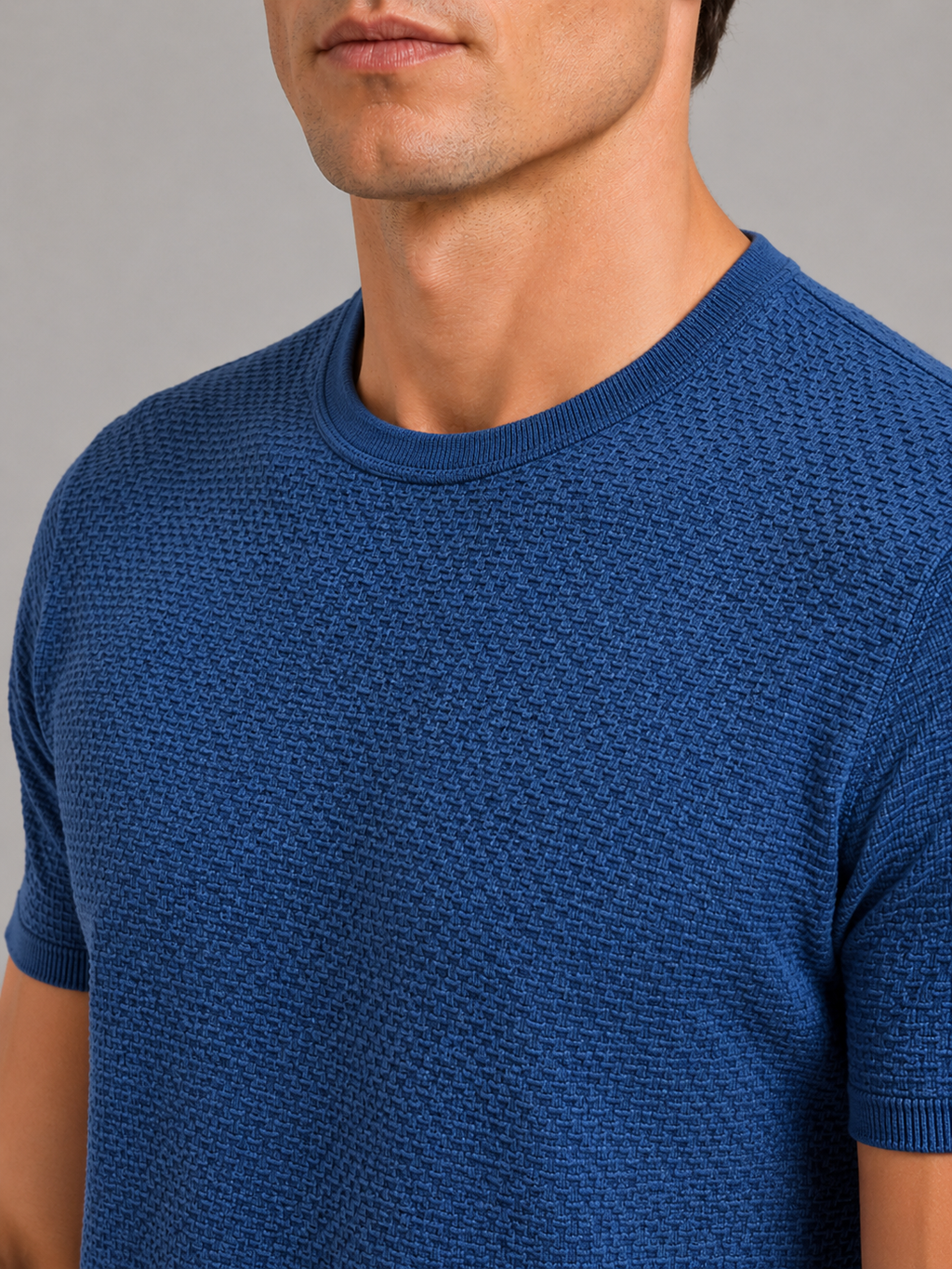 Close up of blue mesh t shirt showing breathable texture and soft stretch fabric detail