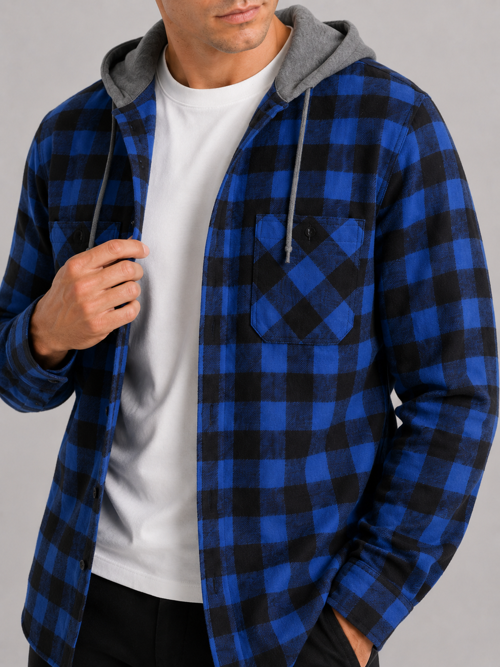 Close up of blue plaid flannel jacket showing soft brushed fabric and hood detail