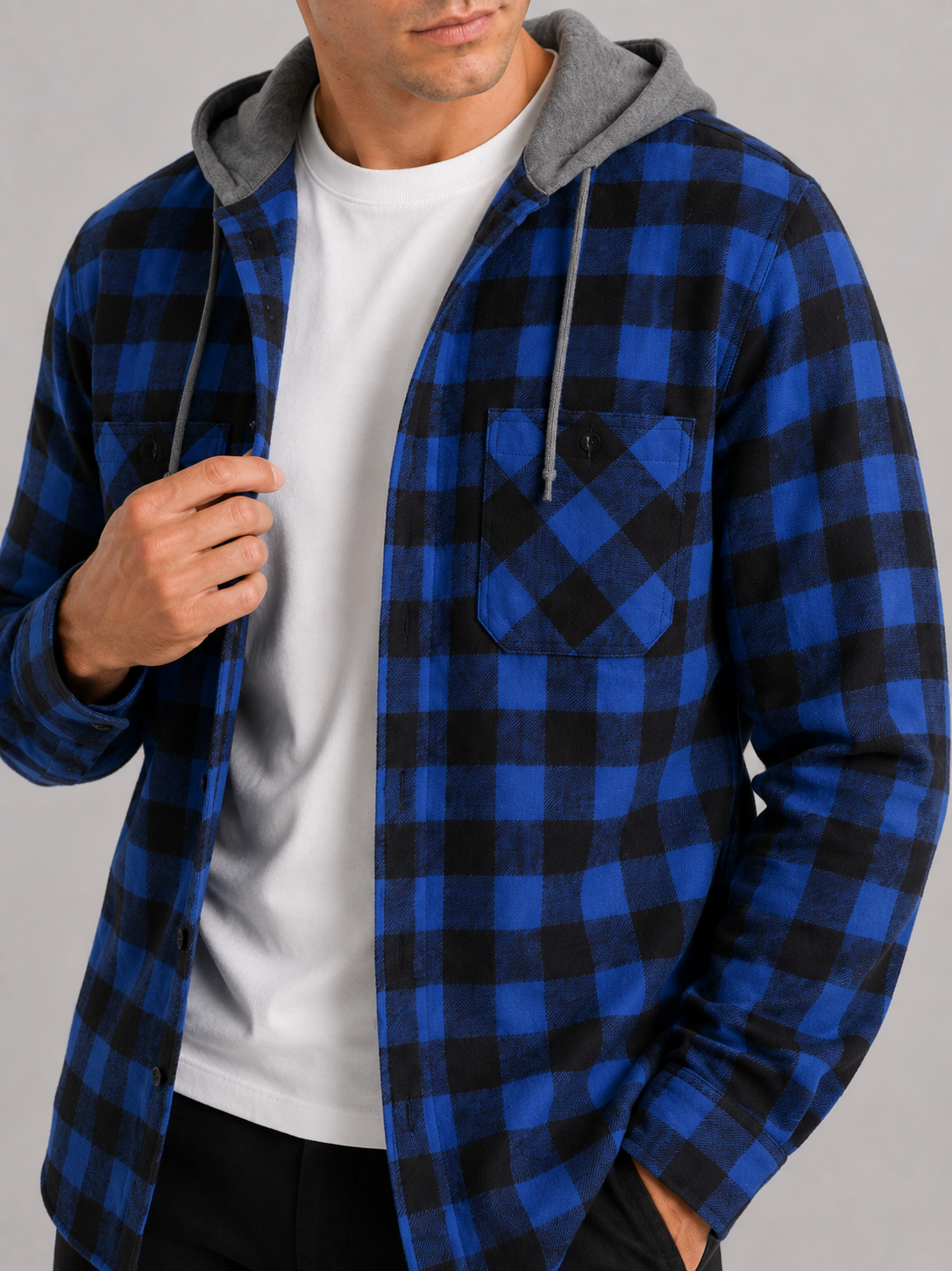 Close up of blue plaid flannel jacket showing soft brushed fabric and hood detail