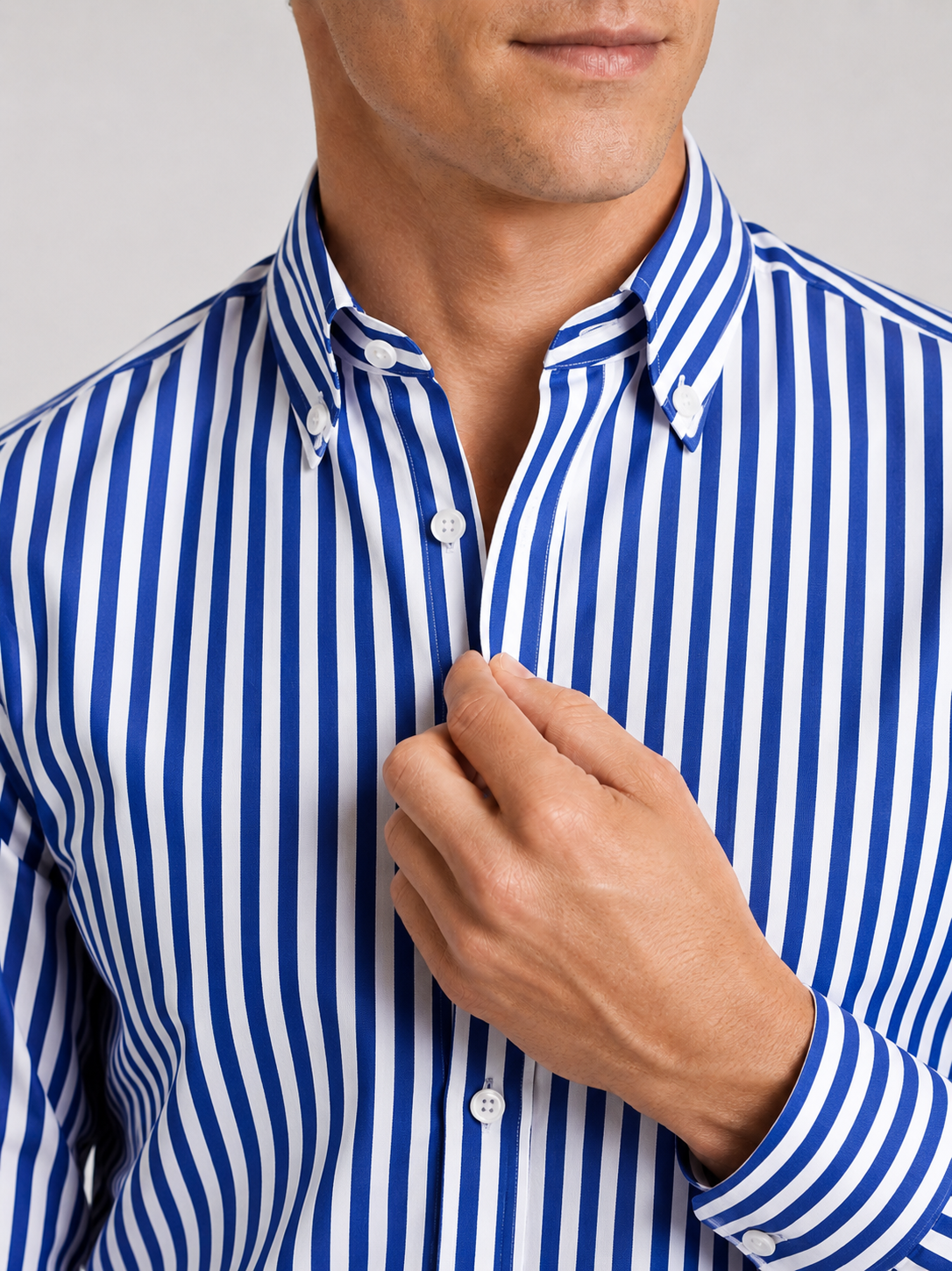 Close up of blue striped dress shirt showing crisp fabric and refined collar detail