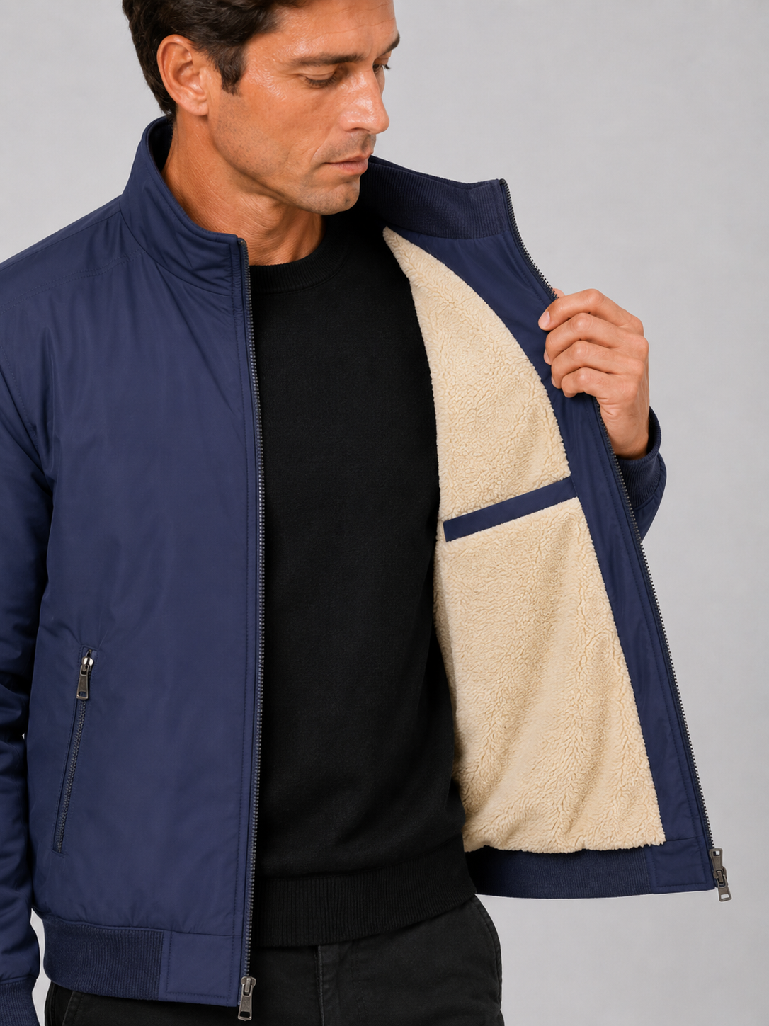 Close up of blue fleece lined jacket showing soft thermal lining and durable outer fabric detail