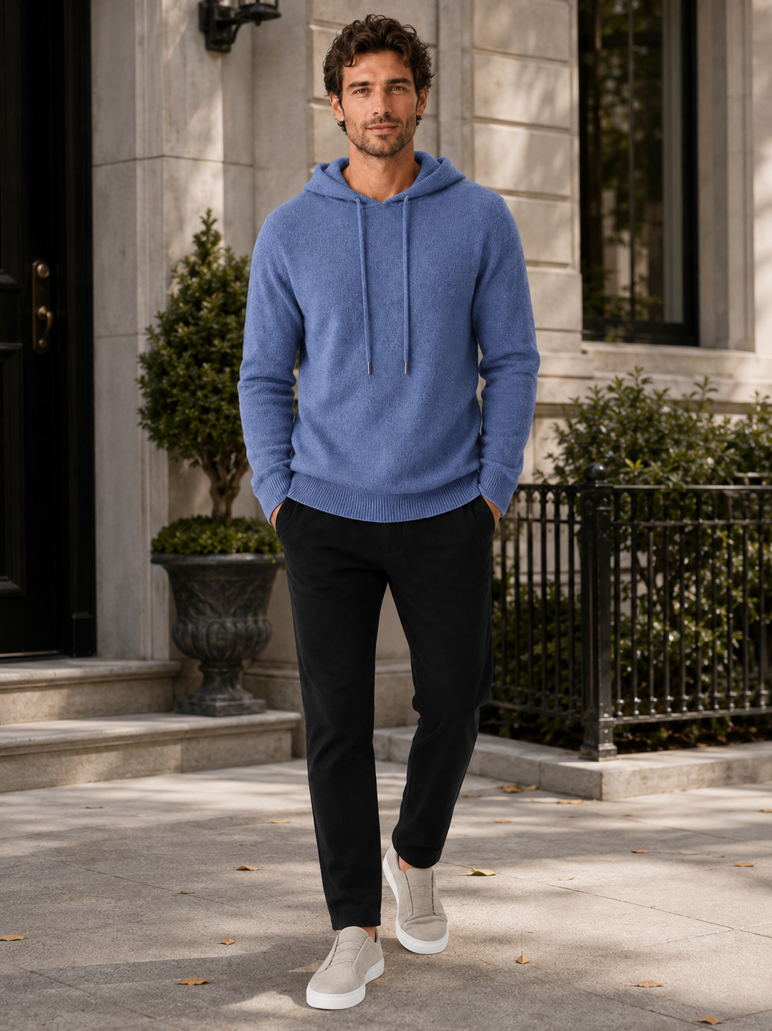 Man wearing a blue wool hoodie sweater in a casual fall winter outfit for everyday wear