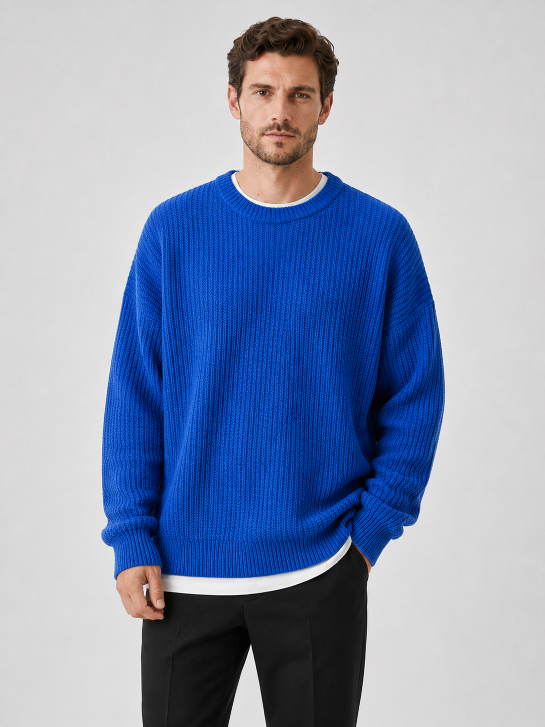 Men wearing blue crewneck sweater loose fit solid color fall business casual style