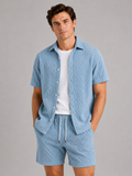 Men wearing blue textured summer matching set short sleeve two piece outfit vacation style