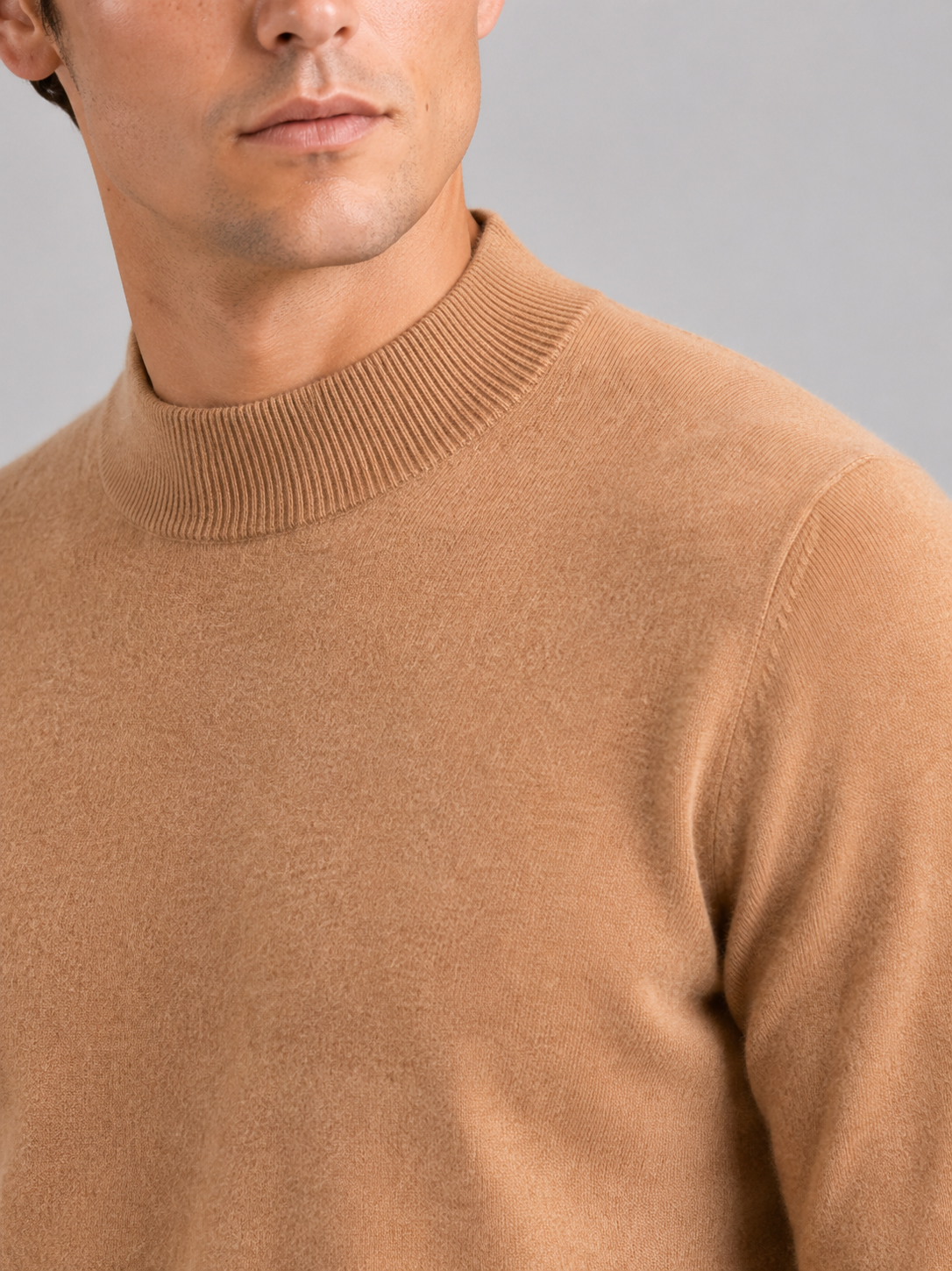 Close up of brown wool mock neck sweater showing soft premium knit texture and refined collar detail