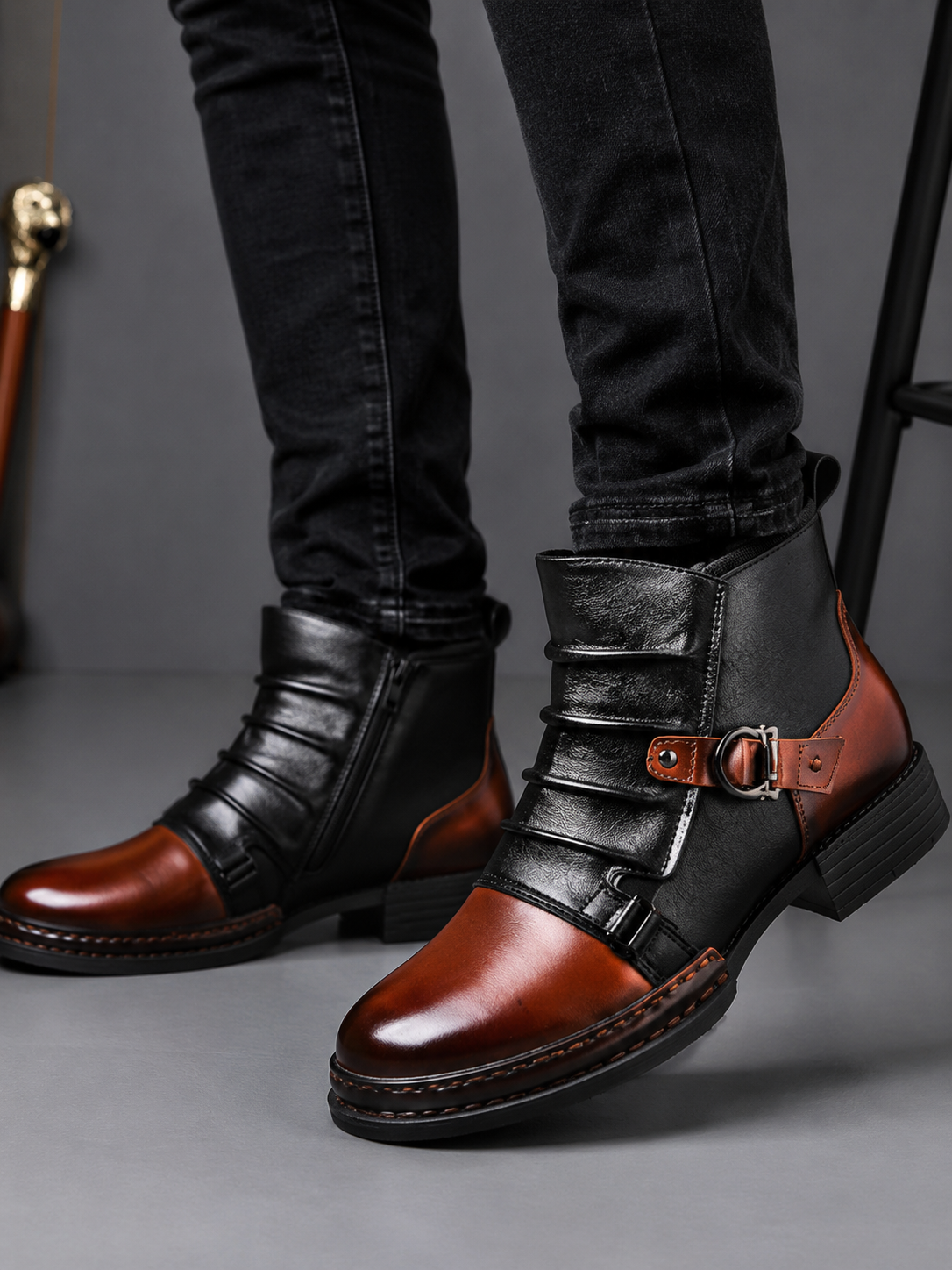 Man wearing brown zip-up leather ankle motorcycle boots with dark slim fit jeans in a casual fall winter outdoor outfit
