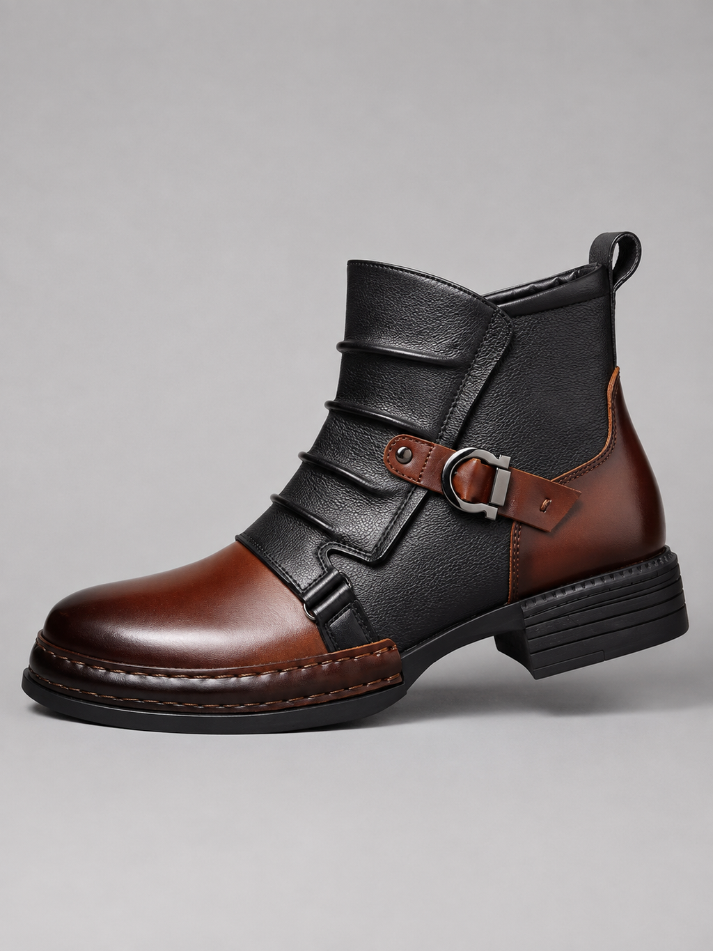 Side of brown men’s ankle motorcycle boots showing the premium leather texture, side zipper, reinforced stitching, treaded rubber sole, and toe cap”