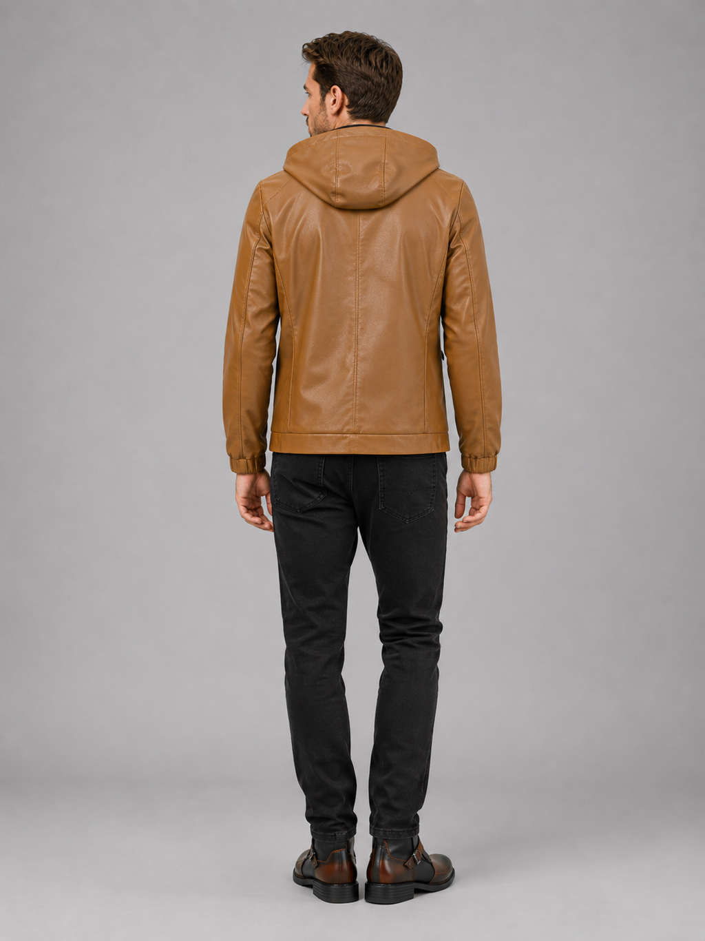 Back view of a man wearing a brown hooded leather jacket showing the attached hood, relaxed fit, long sleeves, and clean back design