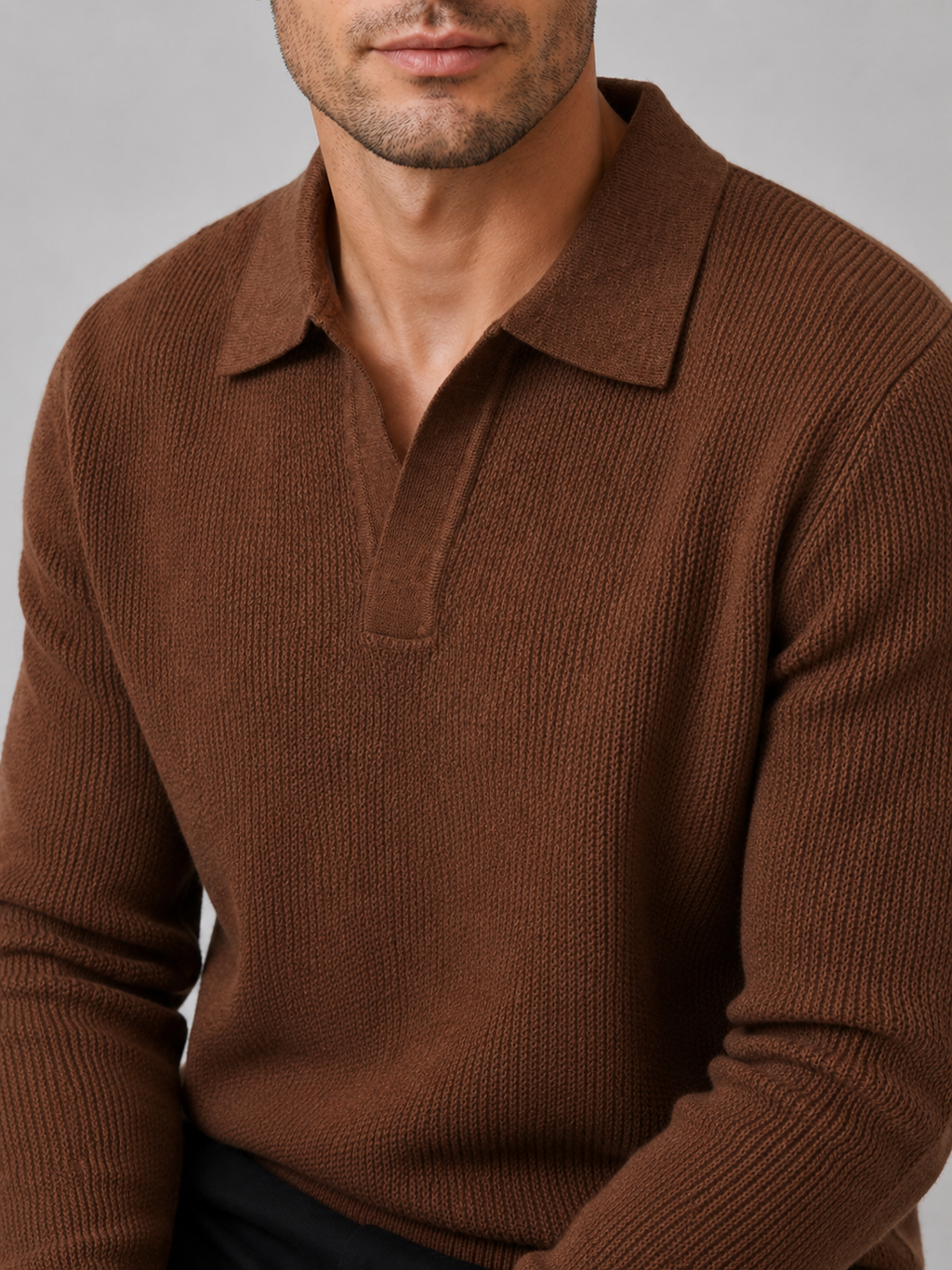 Close-up of a brown Johnny collar sweater showing the thick knit texture, open polo collar, cuffs, and stitching