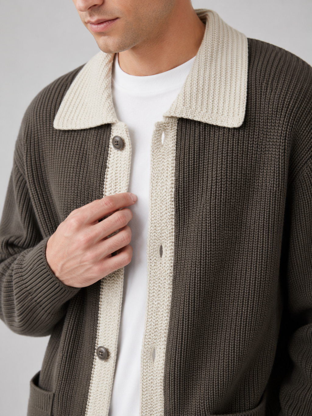 Close up of brown cardigan sweater showing contrast collar detail and soft knit texture