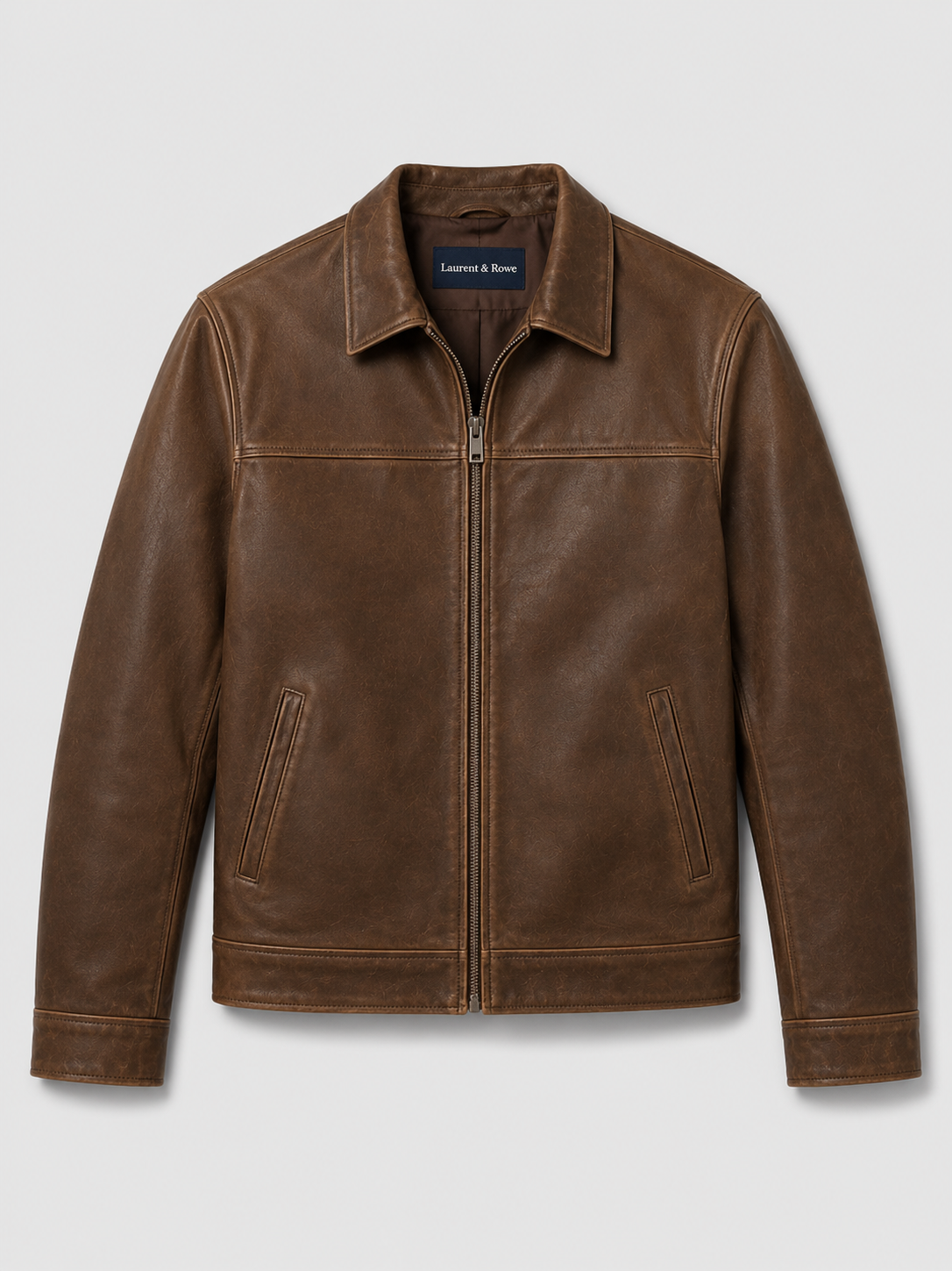 Brown men’s leather flight jacket with a zip-up front and loose fit displayed on a plain background