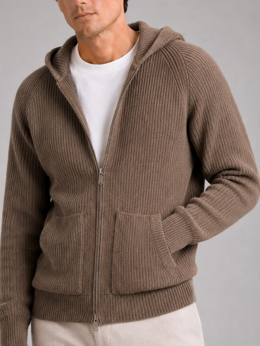 Close up of brown merino wool cardigan showing thick knit texture and zipper detail