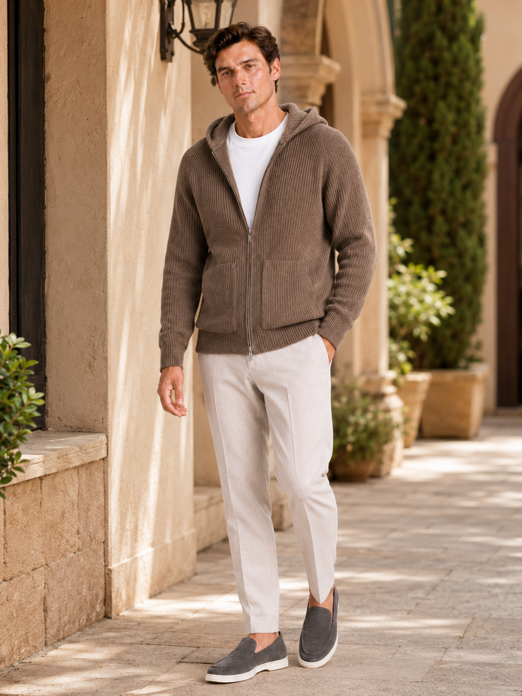 Man styling brown merino wool zip hoodie cardigan in a warm fall winter lifestyle outfit
