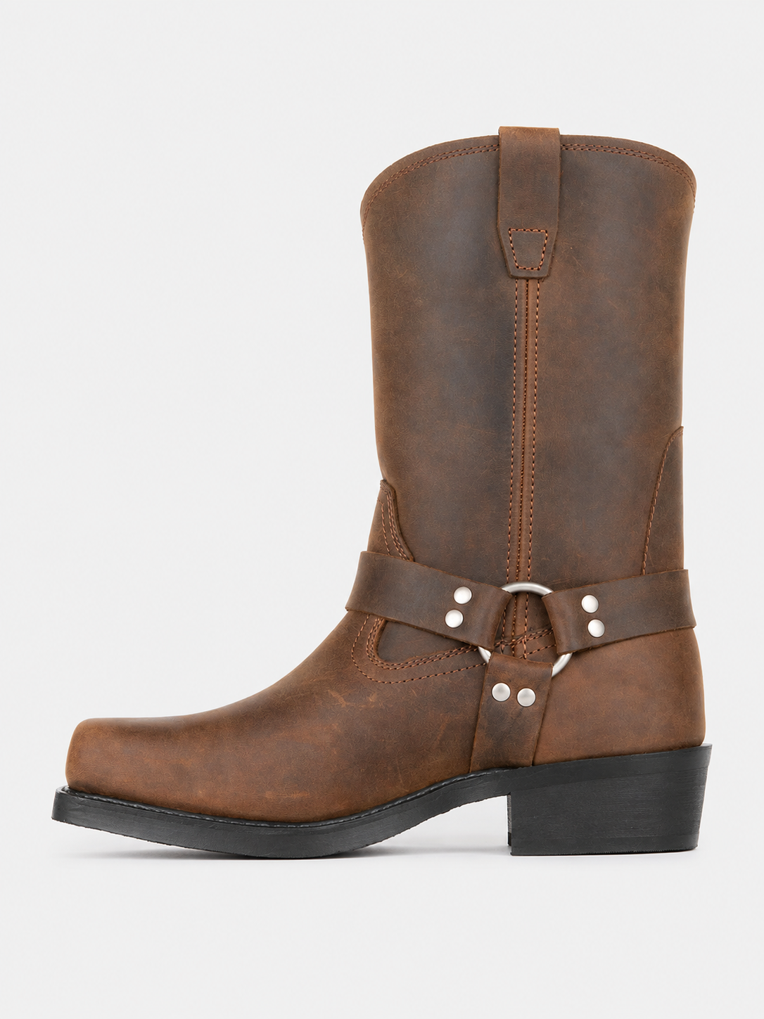 Side view of brown men’s mid calf cowboy boots showing the leather upper, slip-on construction, western silhouette, stacked heel, and durable outsole