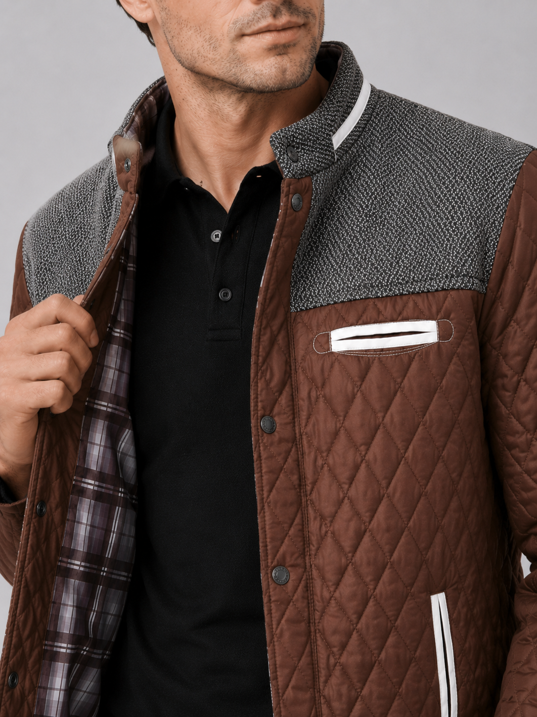 Close up of brown quilted jacket showing diamond stitching and button down front detail