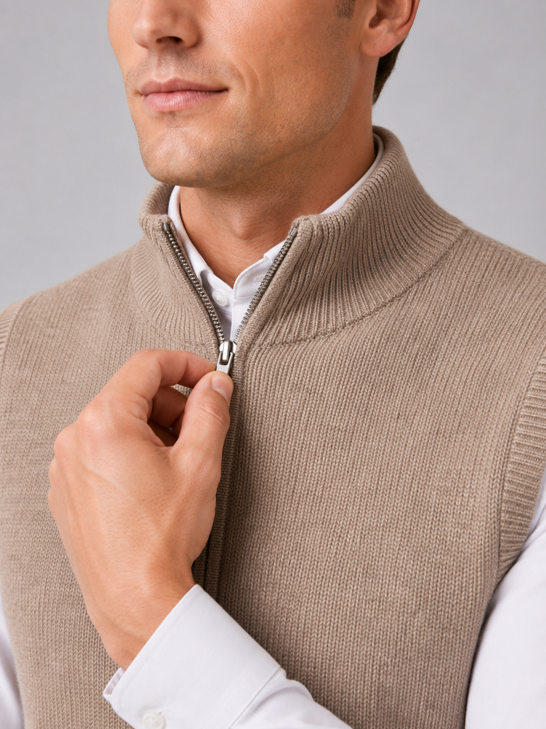 Close up of brown full zip sweater vest showing soft knit texture and mock neck zipper detail