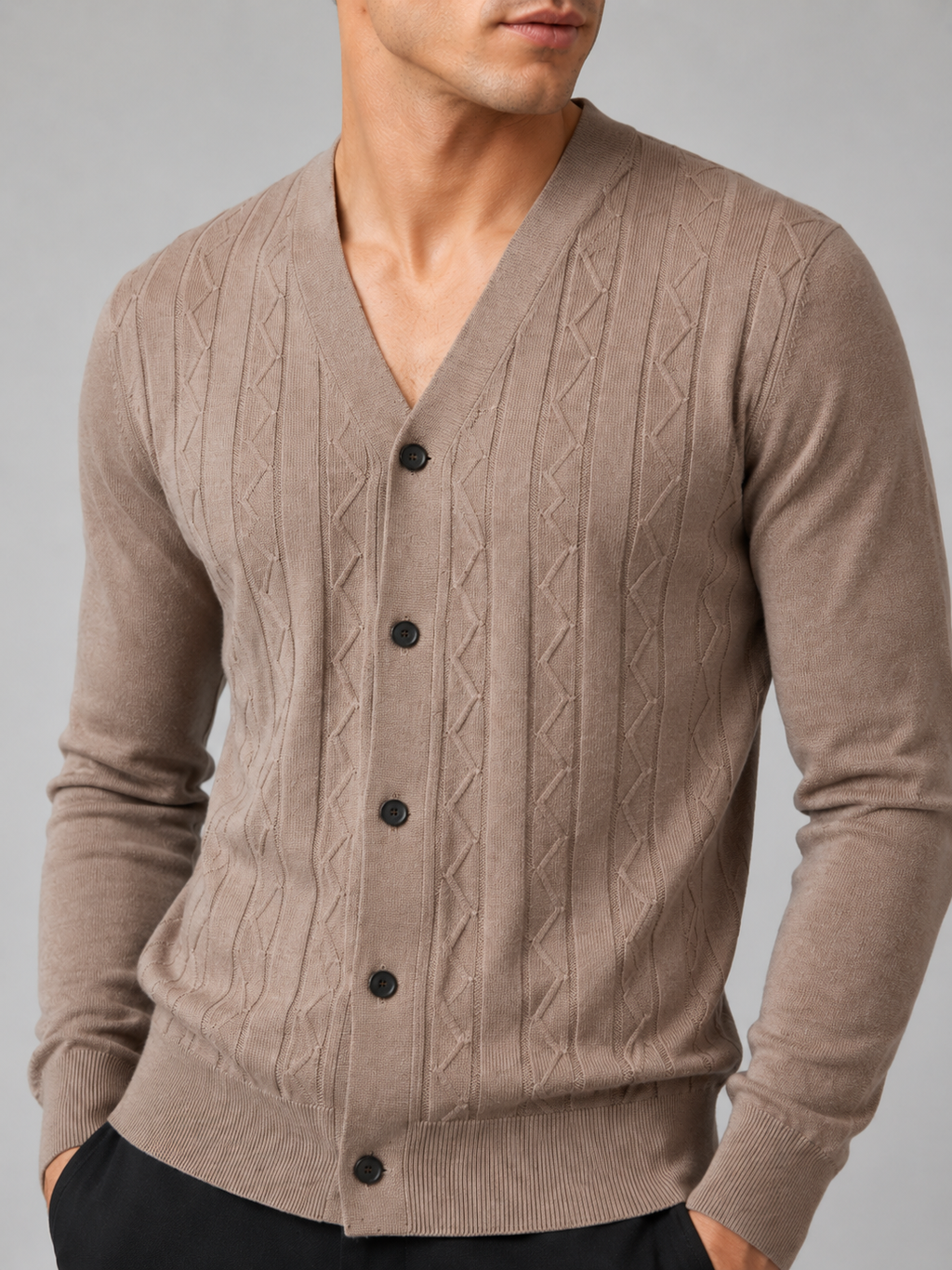 Close up of brown knit cardigan showing soft lightweight texture and refined button front detail