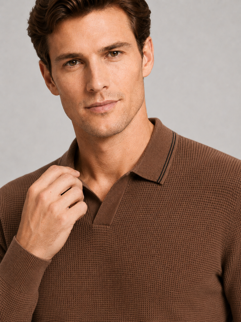 Close up of brown wool polo sweater showing soft knit texture and refined Johnny collar detail