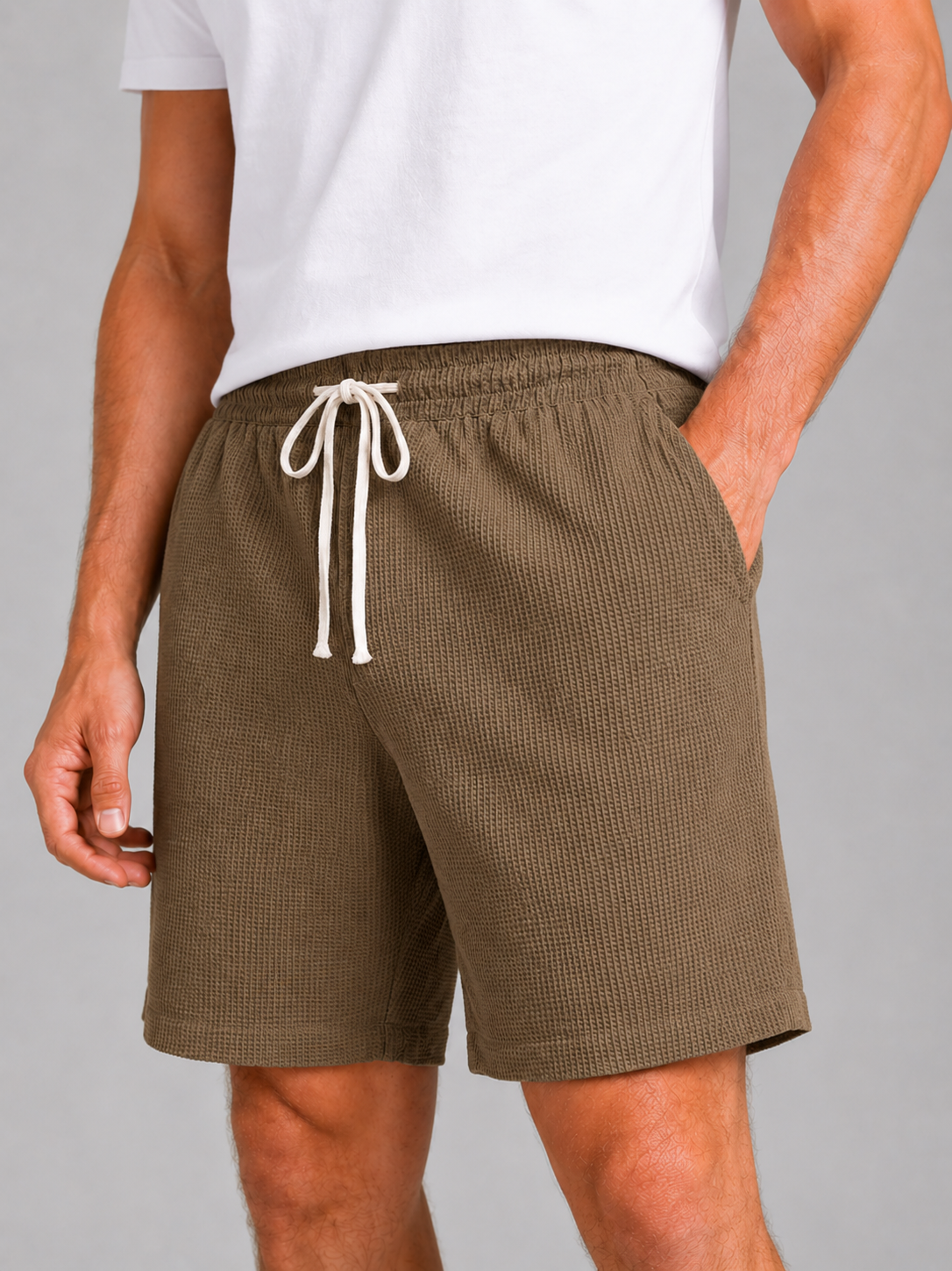 Close up of brown waffle texture shorts showing breathable fabric and adjustable drawstring waistband