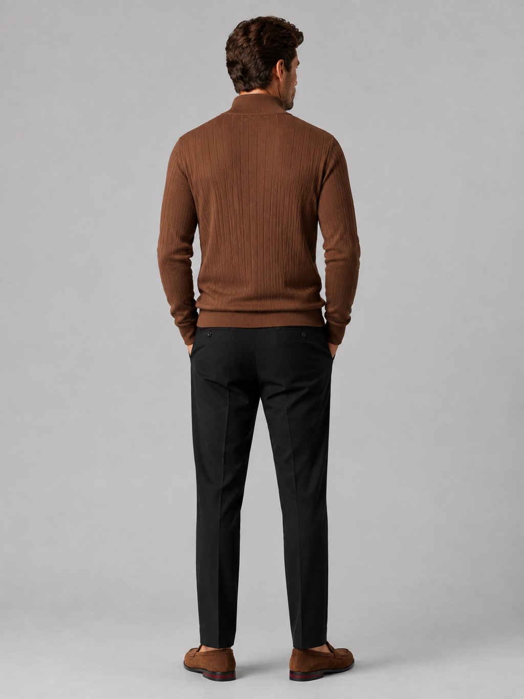 Back view of a man wearing a brown quarter zip sweater showing the long sleeves, clean knit construction, and comfortable fit