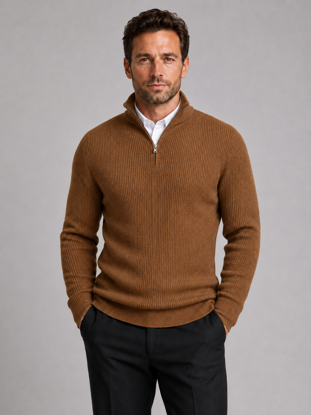 Front view of a man wearing a brown slim fit quarter zip sweater with a mock neck and long sleeves
