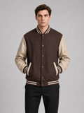 Men wearing brown varsity jacket with leather sleeves and wool blend bomber style for fall winter