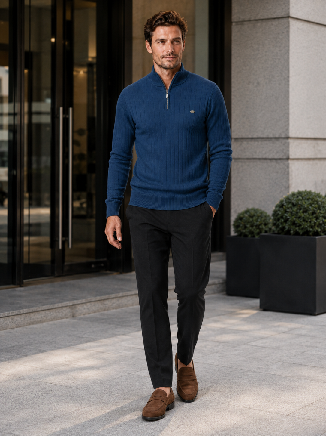 Man wearing a denim blue quarter zip cotton knit sweater in a business casual fall winter outfit for everyday wear