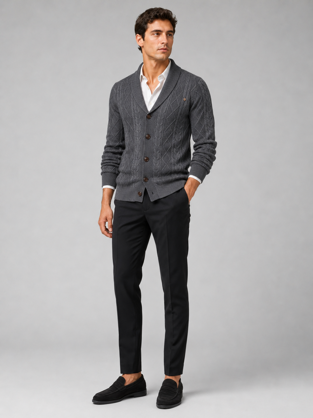 Close up of gray argyle cardigan showing cable knit texture and refined button front detail