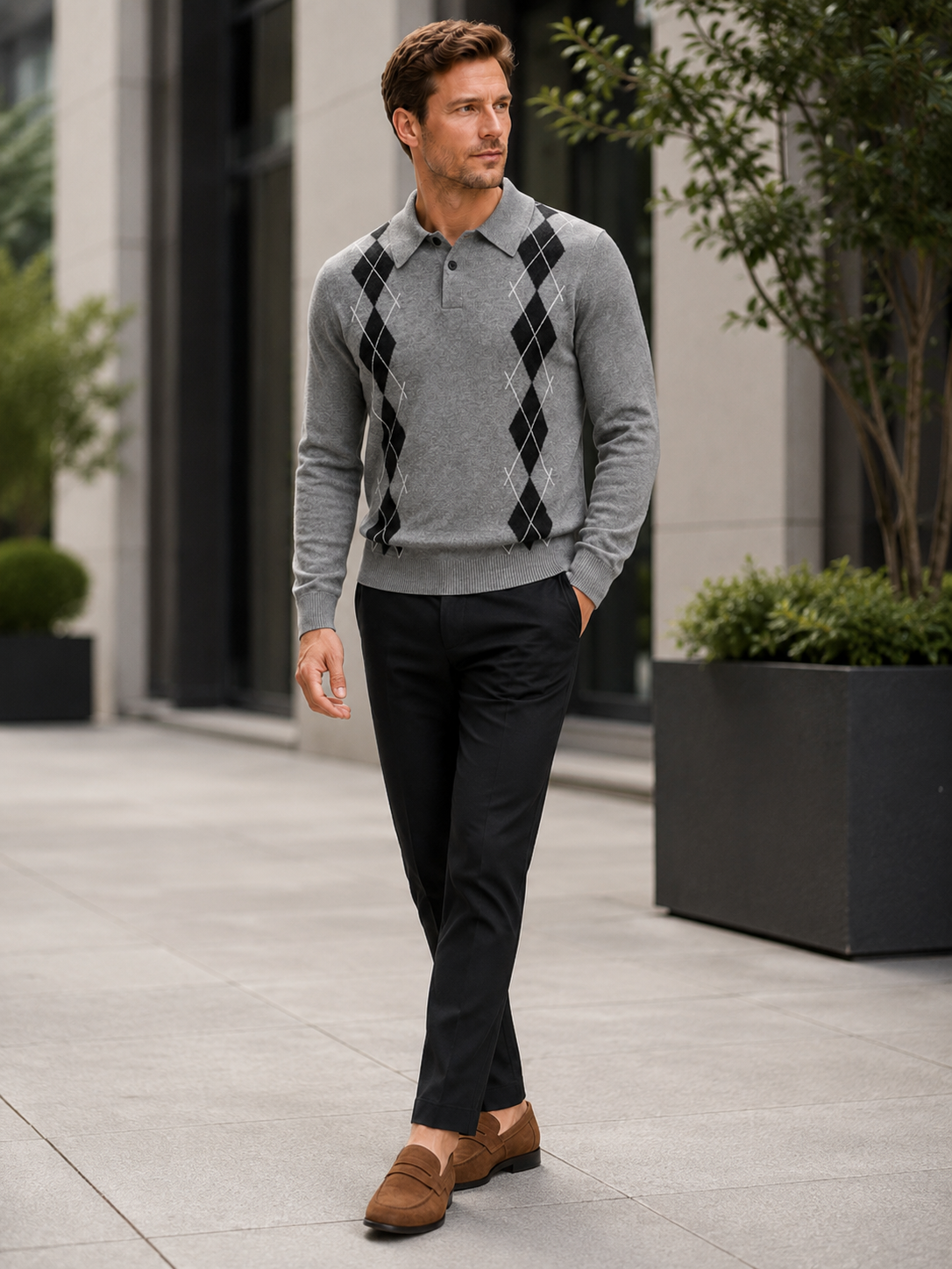 Man wearing a gray argyle plaid knit sweater with a contrast collar in a business casual fall winter outfit