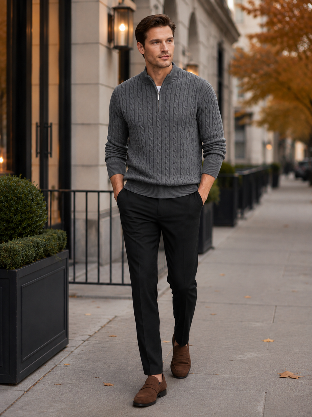 Man styling gray cable knit quarter zip sweater in a clean fall winter everyday outfit