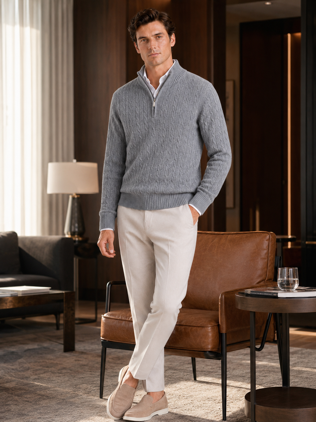 Man styling gray cashmere quarter zip sweater in a refined fall winter lifestyle outfit