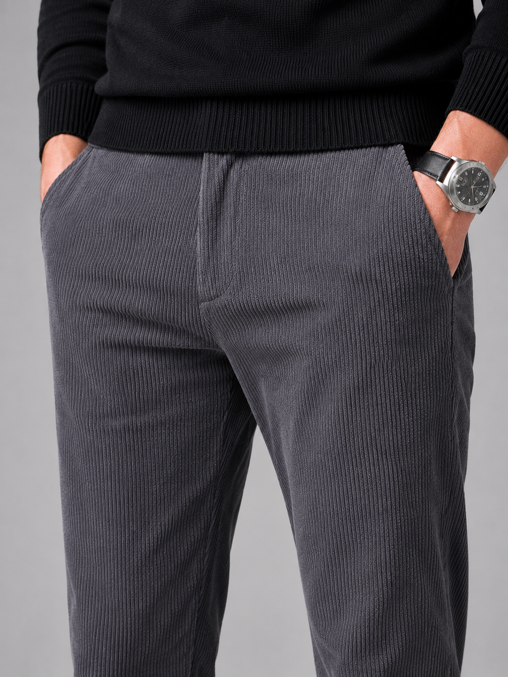 Close up of gray corduroy pants showing soft ribbed texture and stretch fabric detail