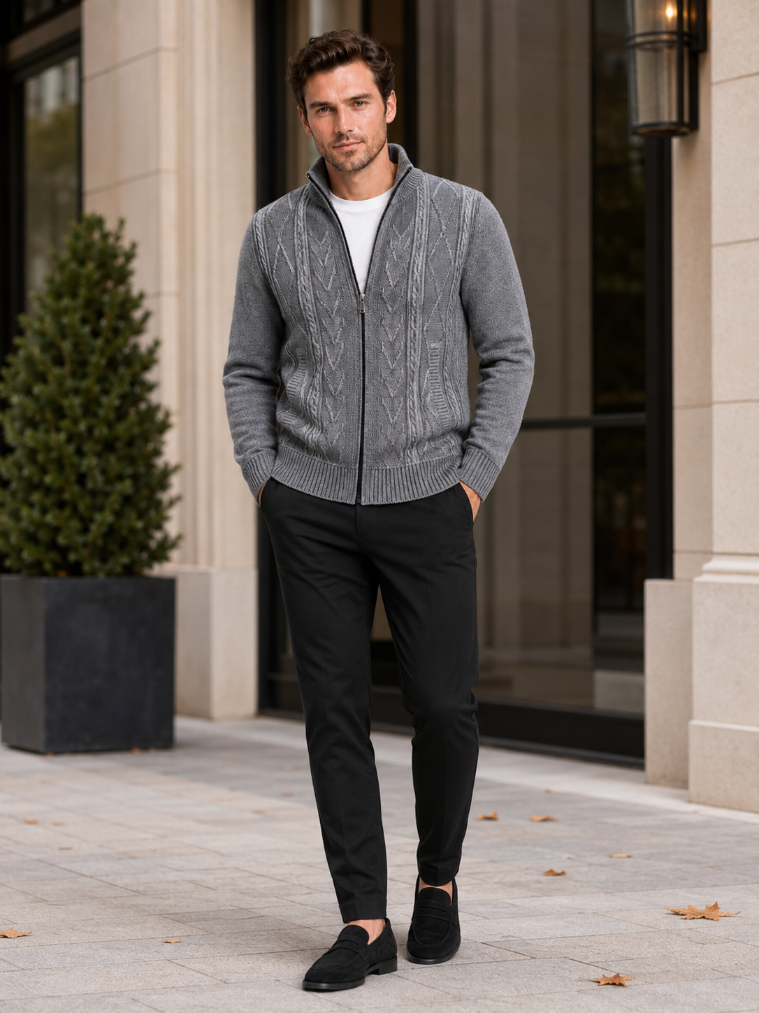 Man styling gray full zip knit sweater in a clean fall winter everyday outfit