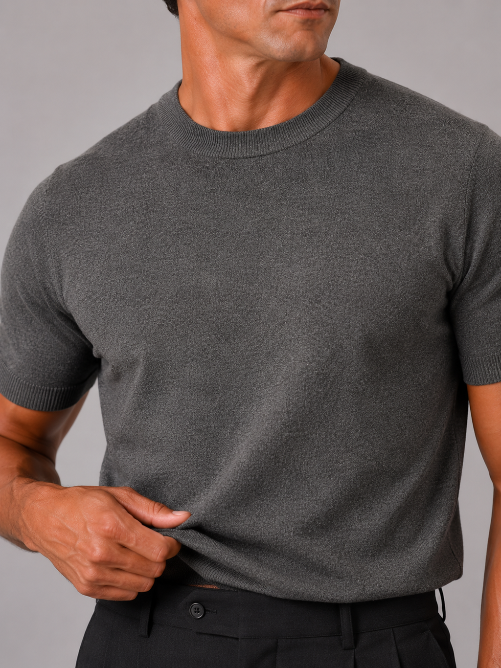Close up of gray knit t shirt showing soft breathable texture and clean crew neck detail