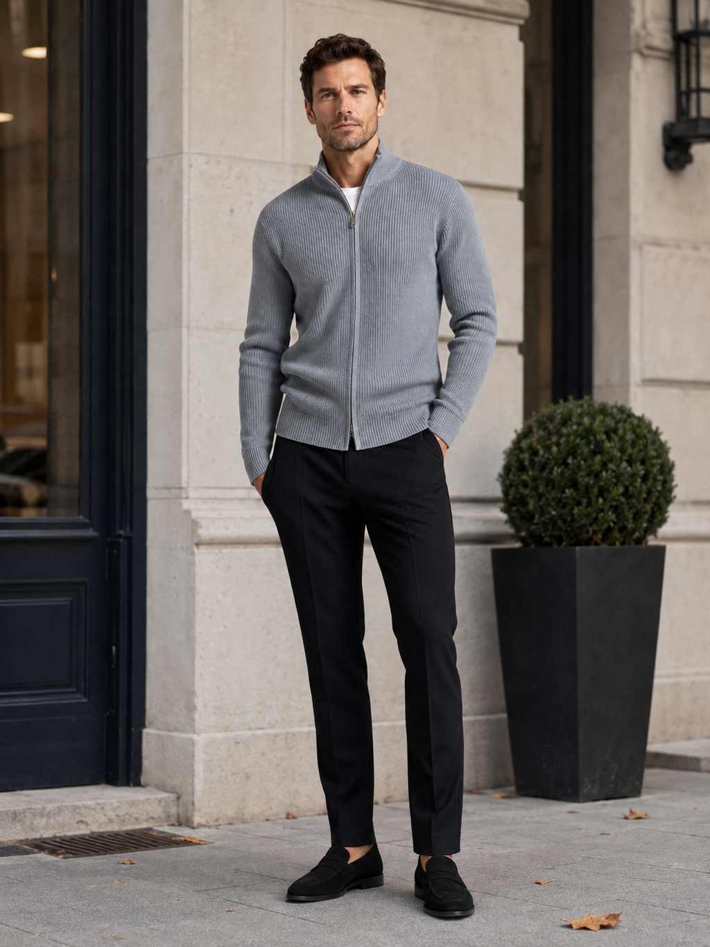 Man wearing a gray ribbed knit full zip cardigan sweater in a casual fall winter outfit for everyday wear