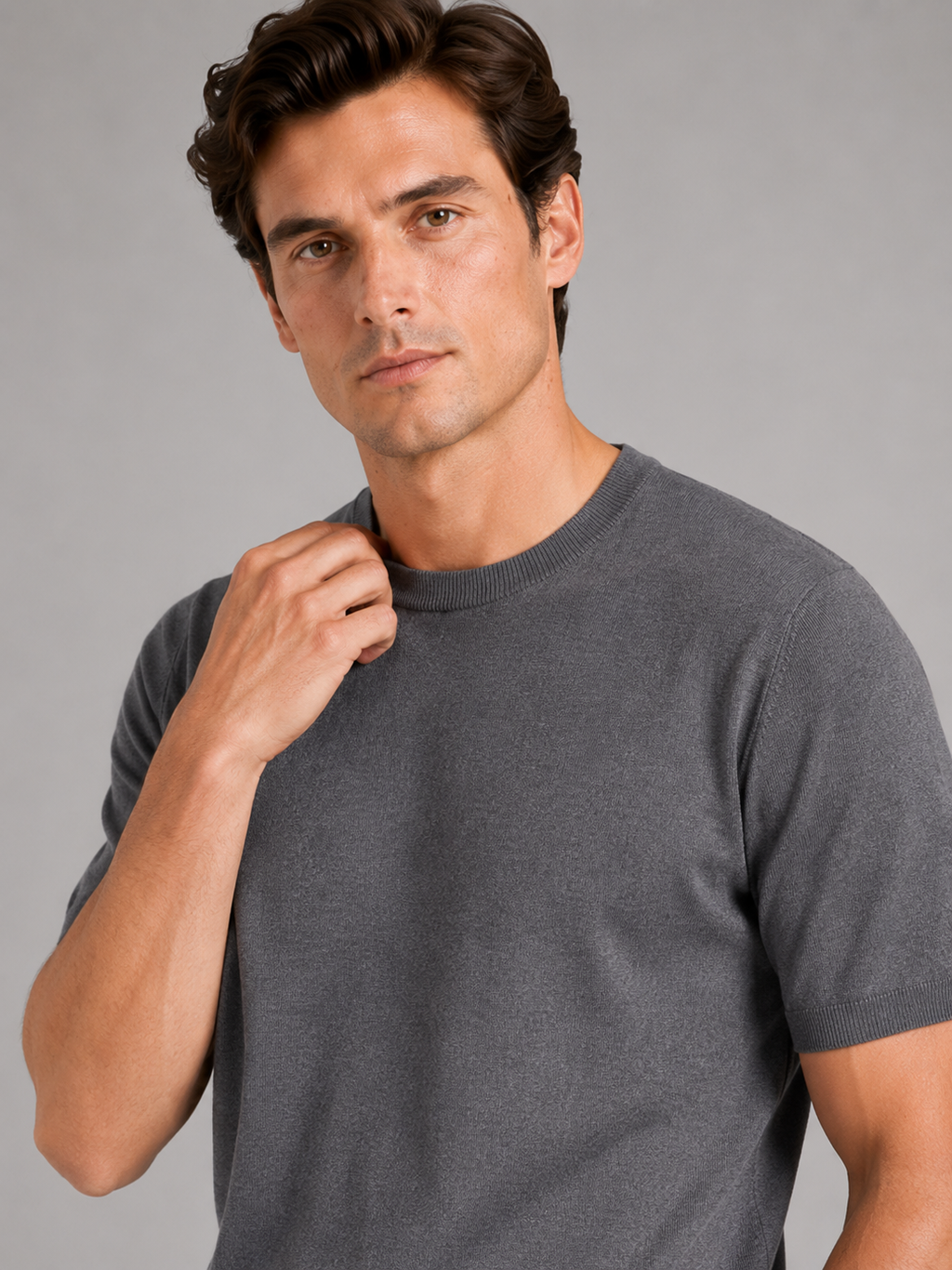 Close up of gray merino wool knit t shirt showing soft breathable texture and crew neck detail
