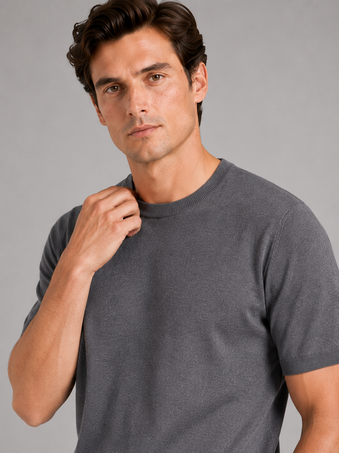 Close up of gray merino wool knit t shirt showing soft breathable texture and crew neck detail