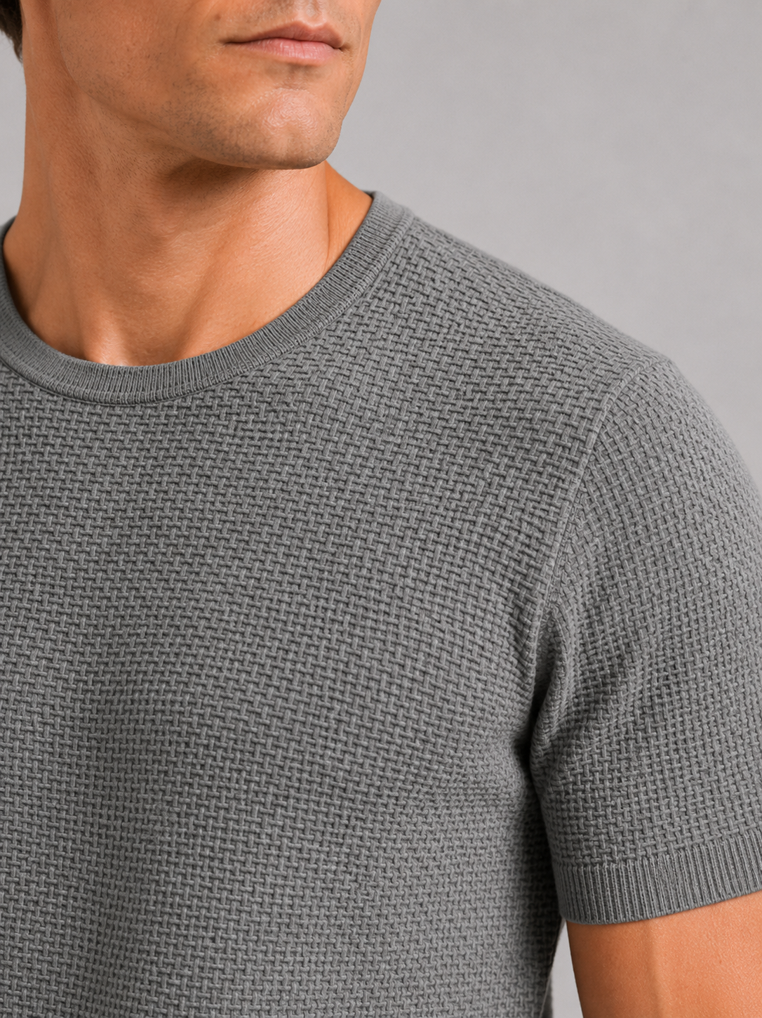 Close up of gray mesh t shirt showing breathable texture and soft stretch fabric detail