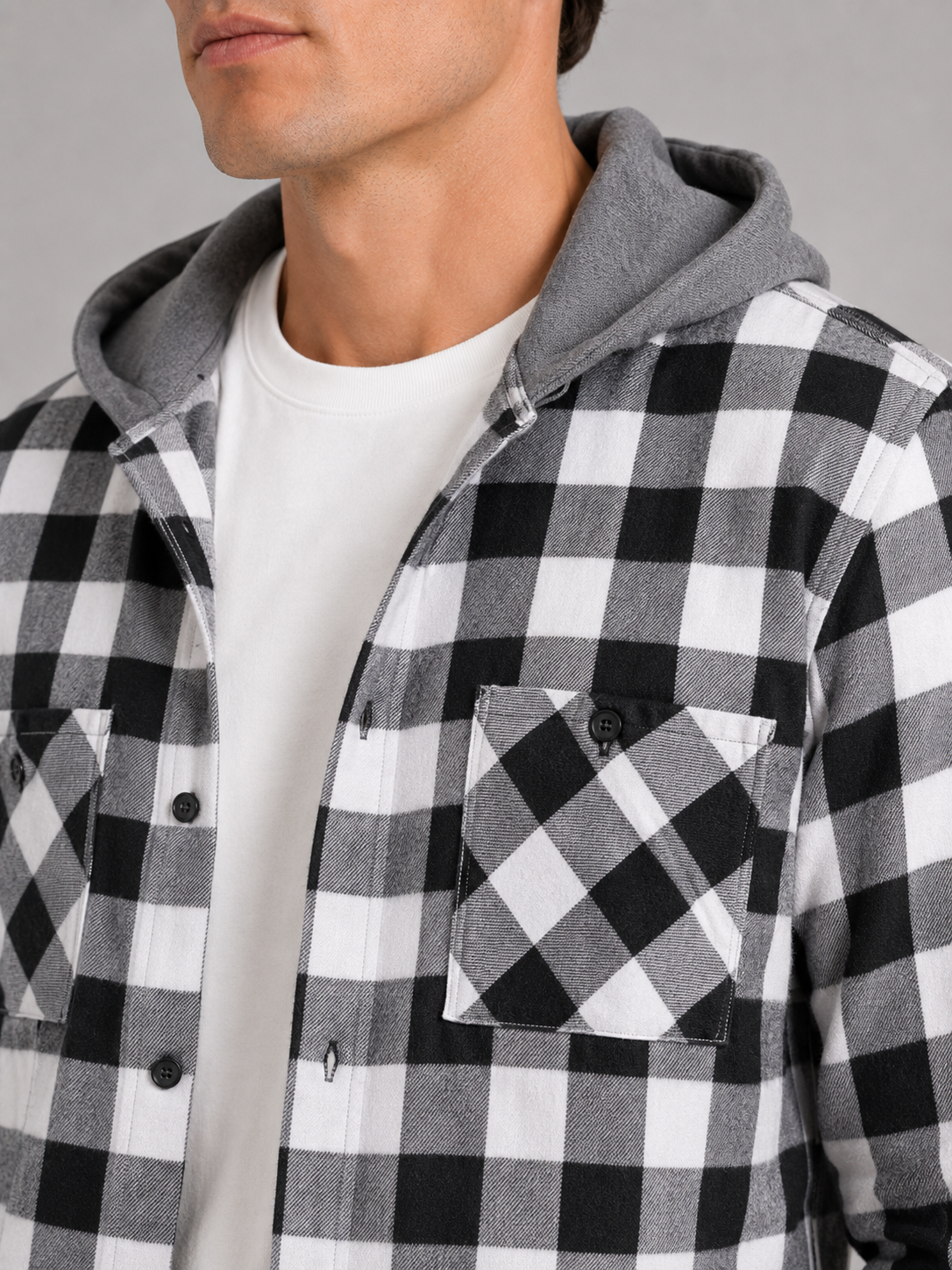 Close up of gray plaid flannel jacket showing soft brushed fabric and hood detail
