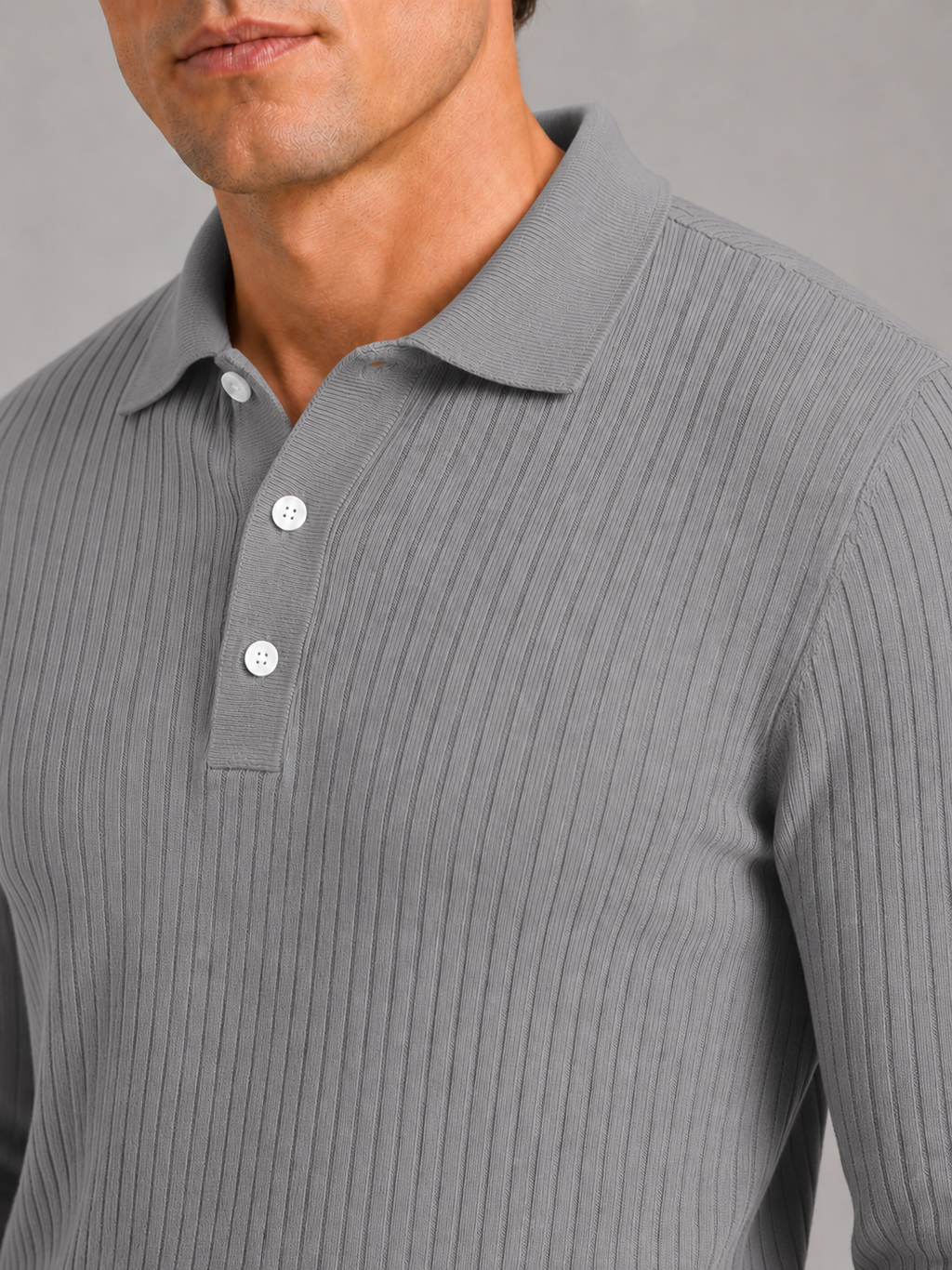 Close up of gray ribbed polo shirt showing soft textured fabric and refined collar detail