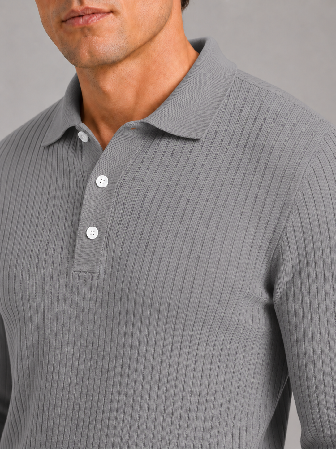 Close up of gray ribbed polo shirt showing soft textured fabric and refined collar detail