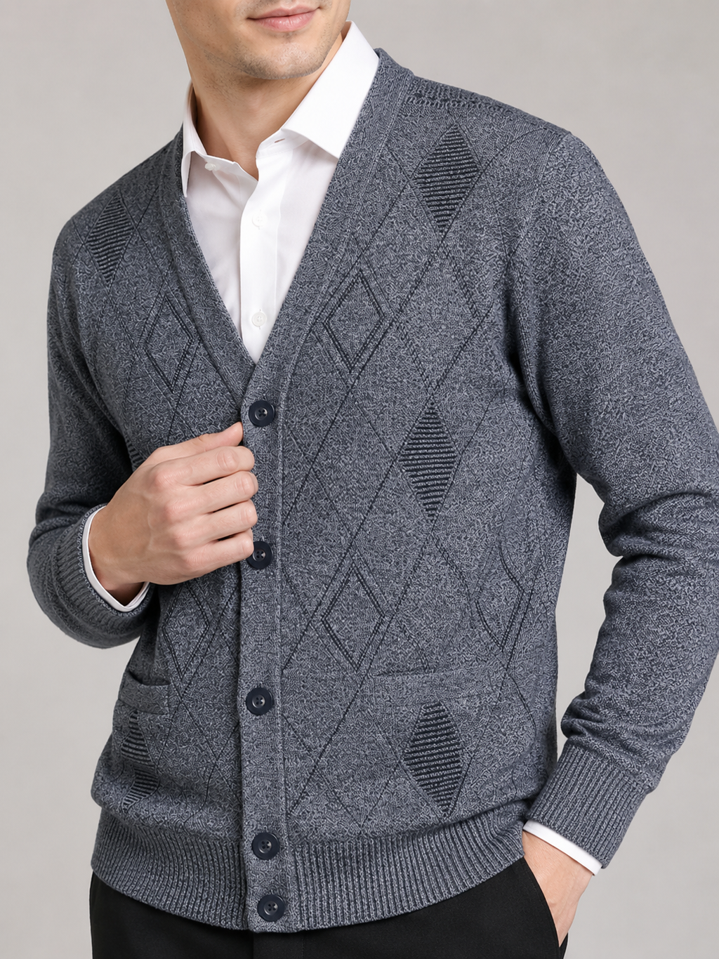 Close up of gray knit cardigan showing soft textured fabric and refined button front detail