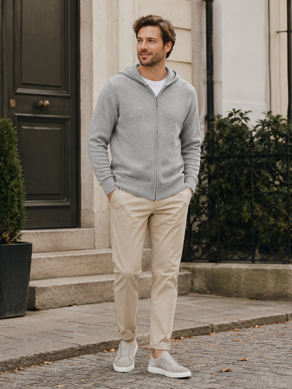 Man wearing a gray wool full zip cardigan hoodie in a casual fall winter outfit for everyday wear