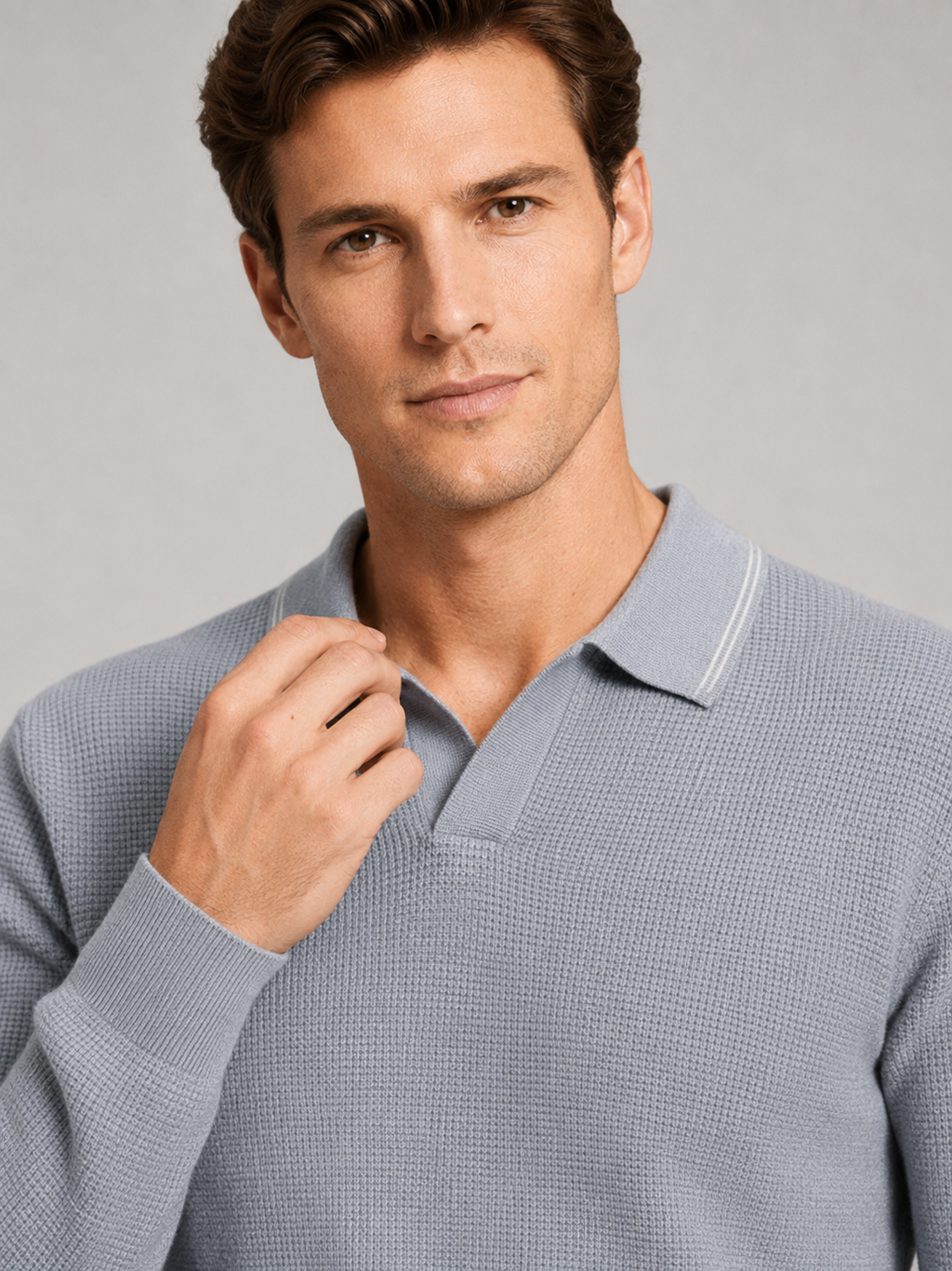 Close up of gray wool polo sweater showing soft knit texture and refined Johnny collar detail